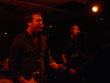 The Mr. T Experience performing live, showing members Dr. Frank (left) and Bobby J (right).