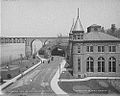 Spring Garden Pumping Station, East River Drive, Philadelphia, PA (pre-1874, demolished pre-1915). John A. Wilson's Pennsylvania Railroad Connecting Bridge (1866–67) can be seen in the background.