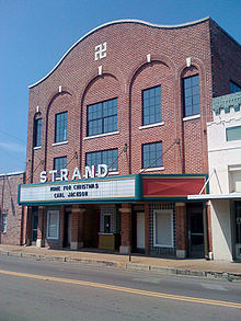 The historic Strand Theatre in downtown Louisville; note that the Swastika incorporated into the building's facade is decorative rather than political, as the theatre antedates the Nazi era. Strand Theatre Louisville.jpg