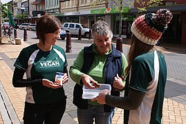 Vegans giving out soy milk alongside banana chocolate chip muffins on the street