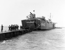 LST-845 "married" to a pontoon causeway during landing operations in Korean/Japanese waters, 26 March 1951 80-G-426659 USS LST-845.png