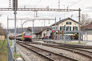 Low platforms with canopies and a two-story building to one side