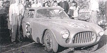 Tom Cole (left) next to the Ferrari 225 S he drove in the race