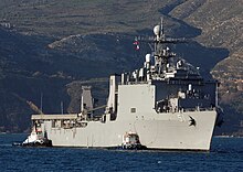 US Navy 060209-N-0780F-002 Tug boats assist the dock landing ship USS Oak Hill (LSD 51) as she arrives for a routine port visit to Greece's largest island.jpg