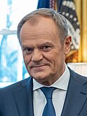 Prime_Minister_Donald_Tusk_of_Poland_in_the_Oval_Office_in_2024_(cropped).jpg