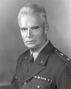 A Caucasian man in his late fifties with gray hair in a military uniform.