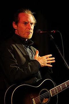 JD Souther holding a guitar, performing live at age 63