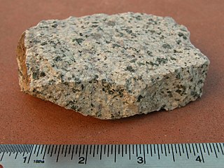 <span class="mw-page-title-main">Monzonite</span> Igneous intrusive rock with low quartz and equal plagioclase and alkali feldspar