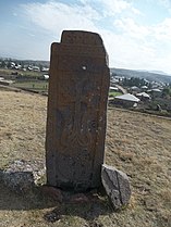 A khachkar, and a view of Akunk