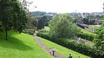 a park, with houses in the distance