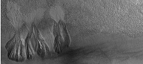 Wide view of group of gullies, as seen by HiRISE under HiWish program. Note that part of this image is enlarged in the following image. 26420gullieswide.jpg