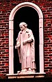 Statue of an elderly man at Sir William Turner's Almhouses