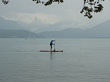 Standup paddle boarding in Lake Annecy Lake Annecy (15279372385).jpg