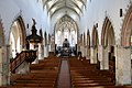 Das Mittelschiff von der Orgelempore aus fotografiert. Im Chor probt der Knabenchor capella vocalis aus Reutlingen. St Martin, Memmingen