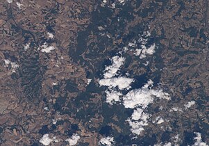 Poggio del Comune (San Gimignano), ... forest, hills, mountain and white clouds