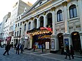 Image 13Music hall evolved into variety shows. First performed in 1912, the Royal Variety Performance was first held at the London Palladium (pictured) in 1941. Performed in front of members of the Royal Family, it is held annually in December and broadcast on television. (from Culture of the United Kingdom)