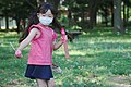 A Japanese young girl plays with soap bubbles