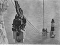 Workers return by cable car from the construction of the lighthouse below the cliffs at Beachy Head c.1900.