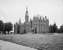 Black and white photograph of Healy Hall with Old North partially visible behind it
