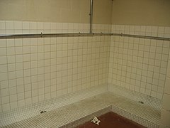 Old-style wall urinal at Stetson Bowl Stadium in Surrey, British Columbia, Canada