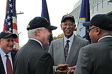 Bing (center right) with Senator Carl Levin (far left) and Secretary of the Navy Ray Mabus (center left) at the 2011 naming ceremony for USS Detroit (LCS-7) 111010-N-SQ656-912 (30233066406).jpg