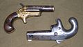 Colt Deringers, at right 1st Model (1870–1890), at left 3rd Model (1875–1912), all .41 rimfire