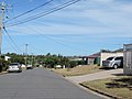 A western-side suburban street.