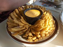 The blooming onion is an onion dish. Blooming onion.jpg