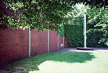 Forbes Field outfield wall and flagpole in its original location in Oakland Forbes flagpole.JPG