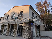 Exterior of TSL's office in Walker Hall, a Spanish Colonial Revival-style building