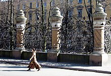 A cast iron grille of decorative railings interspersed by weighty columns in St Petersburg Ironwork.jpg