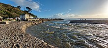 The mouth of the River Seaton in Cornwall after heavy rain caused flooding and significant erosion of the beach