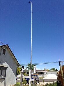 A CWOP home weather station. The mast supports a wind vane and anemometer, while the rain gauge and other sensors are installed near ground level. 2013-06-21 12 55 57 Citizen Weather Observer Program station EW0093 in Elko Nevada.jpg