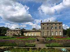 A set of steps leading up to a country house