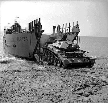 A Crusader Mk I cruiser tank driving off the tank landing craft TLC-124 during tests of a portable concrete roadway 26 April 1942 IWM-H-19057-Crusader-landing-19420426.jpg