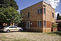 Fire Station Residence, Forest; designed by Government architects E. H. Henderson and Cuthbert Whitley in 1939. Seven residences were attached to the station, each with their own garage[88]