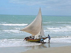 Lateen-rigged jangada on the coast off Mossoró, Brazil