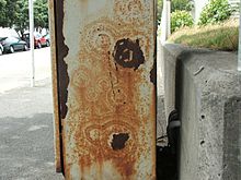 Concentric rust patterns breaking through a painted surface Rustpatterns.jpg