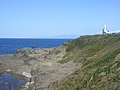 江差町鴎島・鴎島灯台の裏側、この中腹あたりに「弁慶の力石」があったと伝えられている