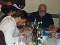 Italiano: Cena con la mailing list di Martyn Mystere in occasione di Lucca Comics 2006. A sinistra Daniele Caluri, a destra Alfredo Castelli, intenti a fare disegni ed autografare fumetti