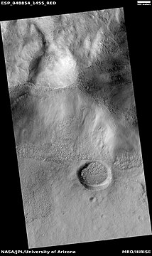 Side view of crater that was cut by a wall, as seen by HiRISE under HiWish program. Other craters are also in this view.