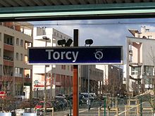 Sign indicating the name of the station (with overlooking the neighbourhood)