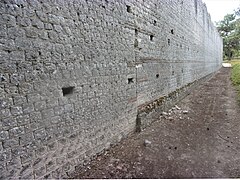 Rebuilding the north wall on the outside.