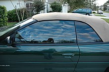 Window tint on a convertible in America. Tint on the front window is lighter than on the back window because of window tint laws. Window tint car.jpg