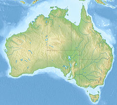 Mapa konturowa Australii, blisko górnej krawiędzi znajduje się punkt z opisem „Darwin”