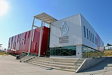 Building exterior in red and silver siding