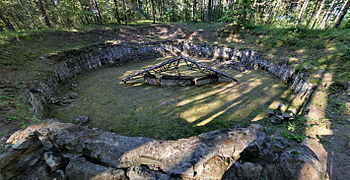 An excavated pit used to cremate corpses