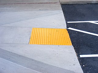 <span class="mw-page-title-main">Tactile paving</span> Textured ground surface indicators to assist blind people