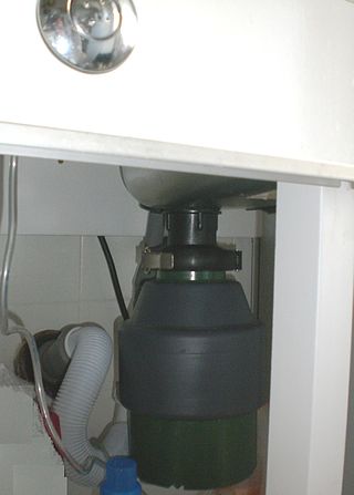 <span class="mw-page-title-main">Garbage disposal unit</span> Device that shreds food waste for disposal via plumbing