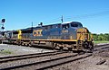 A newer GE ES44DC in the CSX scheme crosses a diamond in Marion, Ohio